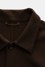 Close-up front view of Moorer Jersey-Jacke 'Keaton' dunkelbraun, a slim fit, lightweight overshirt with a smooth microfiber-viscose blend, featuring a spread collar, four-button placket, and detailed topstitching. 

<p>So fühlt sich Luxus an: Die leichte 