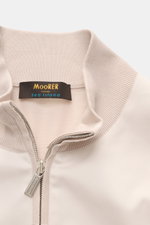 Close-up front view of the collar and zipper of the Moorer Jersey blouson 'Tolly' cream/beige, sporty and elegant with twill trim, made from pure Sea Island cotton, featuring a soft feel, slim fit, two-way zip, standing collar, zip front pockets, elastic 