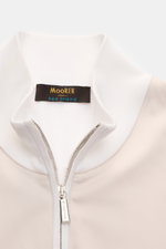 Close-up front view of the Moorer Jersey blouson 'Tolly' white/beige showing the standing collar, two-way zip, and pure cotton twill trim. Sporty and elegant for warm days: With a twill trim and the finest 'Sea Island' cotton, the jersey blouson by MOORER