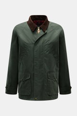 Front view of the Manifattura Ceccarelli Waxed jacket 'Raincaban' dark green, featuring waxed, water repellent cotton, corduroy collar, patch and hand-warmer pockets, raglan sleeves, slim fit, and tartan lining.