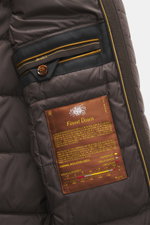 Close-up inside view of Moorer Jacket 'Nobile' dark brown showing buttoned inner pocket, label, and smooth lining from a front angle.

Description:  
<p>With its water repellent finish and clean look with double front, the jacket 'Nobile' by MOORER is the