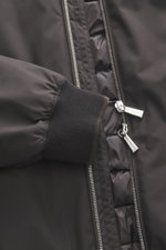 Close-up front view of the Moorer Down blouson 'Oniro' dark brown showing the ribbed cuff, two-way zipper with branded pulls, and quilted lining. Maximum functionality with ultra-light quality: The sporty down blouson 'Oniro' features a light down filling