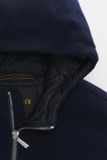 Close-up shot from above of the navy knit hood and zipper of the Moorer Down blouson 'Brigno' navy, showing quilted lining and branded zipper pull.

Description: High performance at temperatures from above freezing to below zero: The knitted down blouson 