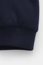 Close-up front view of the knit hem and cuff of the Moorer Down blouson 'Brigno' navy, made of soft virgin wool-cashmere blend with quilted lining, slim fit, warming down filling, robust zipper, hood with drawstring, concealed pockets, and elastic rib cuf