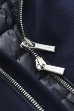 Close-up front view of the Moorer Down blouson 'Brigno' navy showing silver two-way zipper on navy wool-cashmere knit fabric with quilted lining, highlighting artisanal craftsmanship and functional warmth. High performance at temperatures from above freez