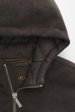 Close-up front view of the hood and zipper area of the Moorer Down blouson 'Brigno' grey-brown melange, showcasing its virgin wool-cashmere blend knit and quilted down lining, with a durable two-way zipper and elastic rib cuffs. High performance at temper