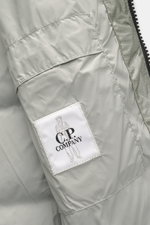 Close-up inside view of C.P. Company Down jacket 'DD Shell' sage showing microfiber ripstop fabric, pocket, and brand label.

Description: <p>For the lightweight down jacket 'DD Shell', C.P. COMPANY uses durable ripstop fabric and high-quality padding wit