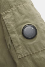 Close-up side view of C.P. Company Down jacket olive sleeve with high-quality microfiber, removable down filling, regular fit, durable two-way zipper, wind flap with press studs, high collar with stowable hood, zipper front pockets, adjustable hem, cuff c