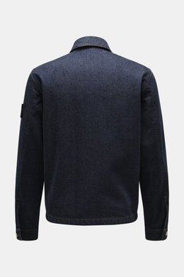 Back view of Stone Island Denim jacket 'Indigo Denim-Rinsed' dark blue, slim fit indigo-dyed cotton denim with typical fabric texture, turn-down collar, cuffs with button, and compass badge on upper sleeve.