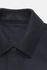 Close-up front view of Stone Island Jacket 'Panno Ghost Piece' navy, slim fit, mix of wool and microfiber, textured feel, five-button placket, patch chest pockets, front flap pockets, turn-down collar, tonal compass badge on sleeve, snap button cuffs, smo