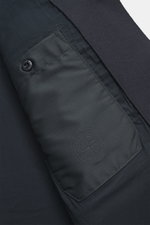 Stone Island Jacket 'Panno Ghost Piece' navy close-up inside view showing smooth lining, inside pocket, snap button cuff, tonal badge, wool and microfiber.