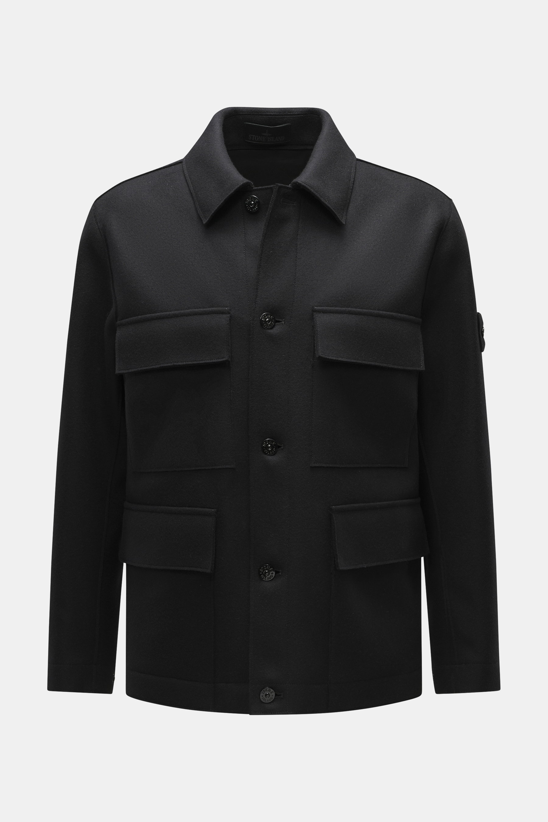 Front view of Stone Island Jacket 'Panno Ghost Piece' black, a slim fit jacket with a mix of wool and microfiber, textured feel, five-button placket, patch chest pockets, front flap pockets, turn-down collar, tonal compass badge on sleeve, snap button cuf