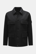Front view of Stone Island Jacket 'Panno Ghost Piece' black, a slim fit jacket with a mix of wool and microfiber, textured feel, five-button placket, patch chest pockets, front flap pockets, turn-down collar, tonal compass badge on sleeve, snap button cuf