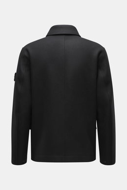 Back view of Stone Island Jacket 'Panno Ghost Piece' black, slim fit with mix of wool and microfiber, textured feel, five-button placket, patch chest and front flap pockets, turn-down collar, tonal compass badge on sleeve, snap button cuffs, smooth lining