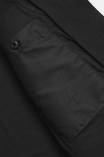 Stone Island Jacket 'Panno Ghost Piece' black photographed close-up from the inside showing smooth lining fabric, one inside pocket with snap button, tonal compass badge, mix of wool and microfiber, textured feel, slim fit, five-button placket, patch ches