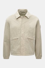 Front view of Stone Island Jacket 'David Light-TC Ghost Piece' sand, made of high-quality microfiber with anti-drop finish, velvety feel, regular fit, concealed button placket, turn-down collar, slanted welt pockets with snap button, tonal compass badge, 