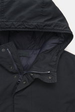Close-up front view of Stone Island Down Jacket 'Ghost Piece David-TC' navy, showcasing high-quality microfiber, velvety touch, garment dyed fabric, warm down filling, Regular Fit, robust two-way zipper, wind flap with snap buttons, hood with drawstring, 