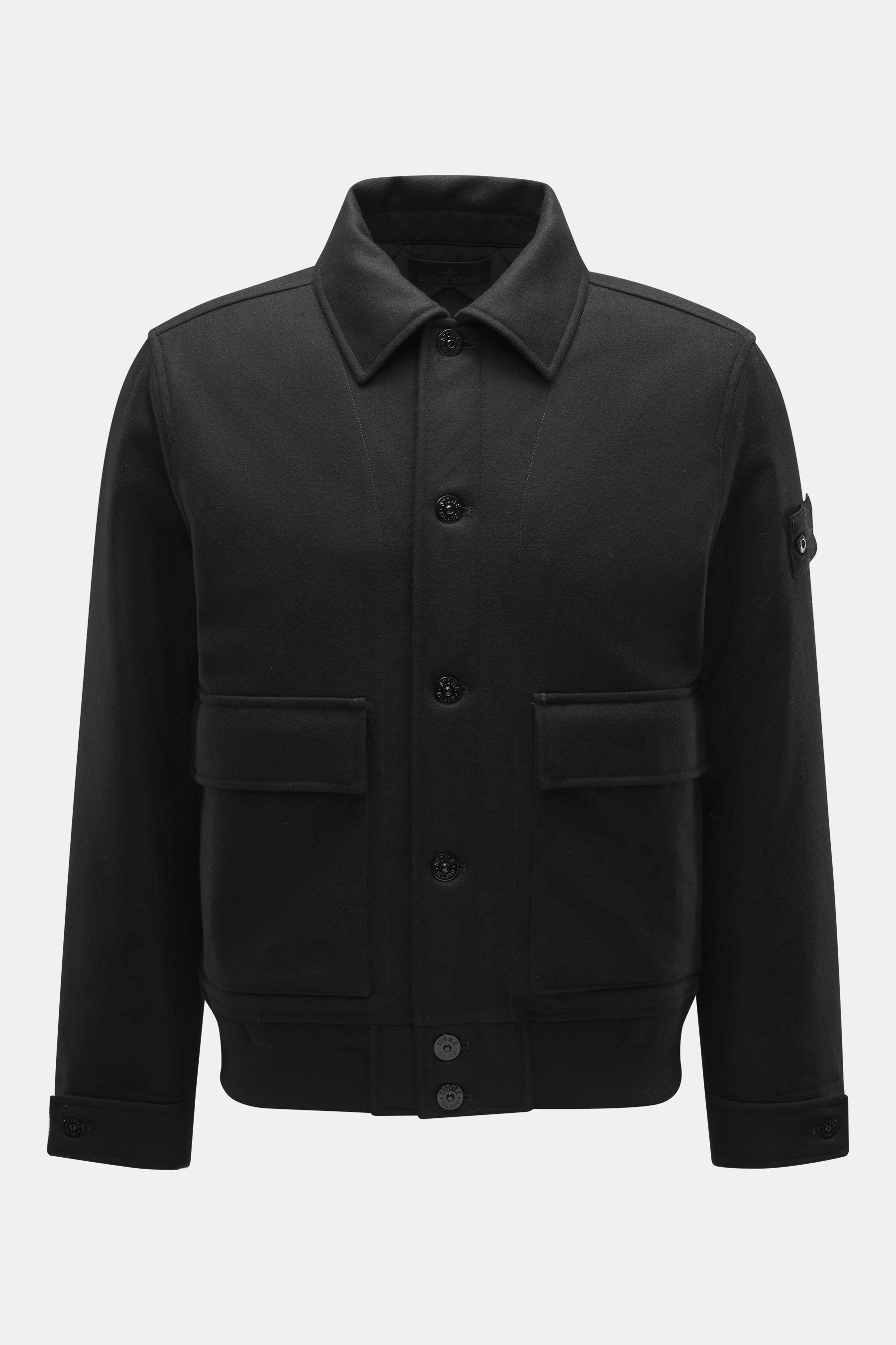 Front view of Stone Island Blouson 'Wool Nylon Flannel Ghost Piece' black, slim fit with six-button placket, turn-down collar, tonal badge on upper arm, buttoned sleeve cuffs, quilted lining fabric, one inside pocket, made of mix of virgin wool and microf