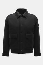Front view of Stone Island Blouson 'Wool Nylon Flannel Ghost Piece' black, slim fit with six-button placket, turn-down collar, tonal badge on upper arm, buttoned sleeve cuffs, quilted lining fabric, one inside pocket, made of mix of virgin wool and microf