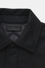 Close-up front view of Stone Island Blouson 'Wool Nylon Flannel Ghost Piece' black featuring mix of virgin wool and microfiber, soft feel, slim fit, six-button placket, turn-down collar, tonal badge on upper arm, buttoned sleeve cuffs, quilted lining fabr