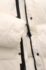 Close-up front view of the Stone Island Down jacket 'Garment Dyed Crinkle Reps NY' cream, showing the black two-way zipper and snap buttons on innovative coated crinkle fabric with warm down lining.
