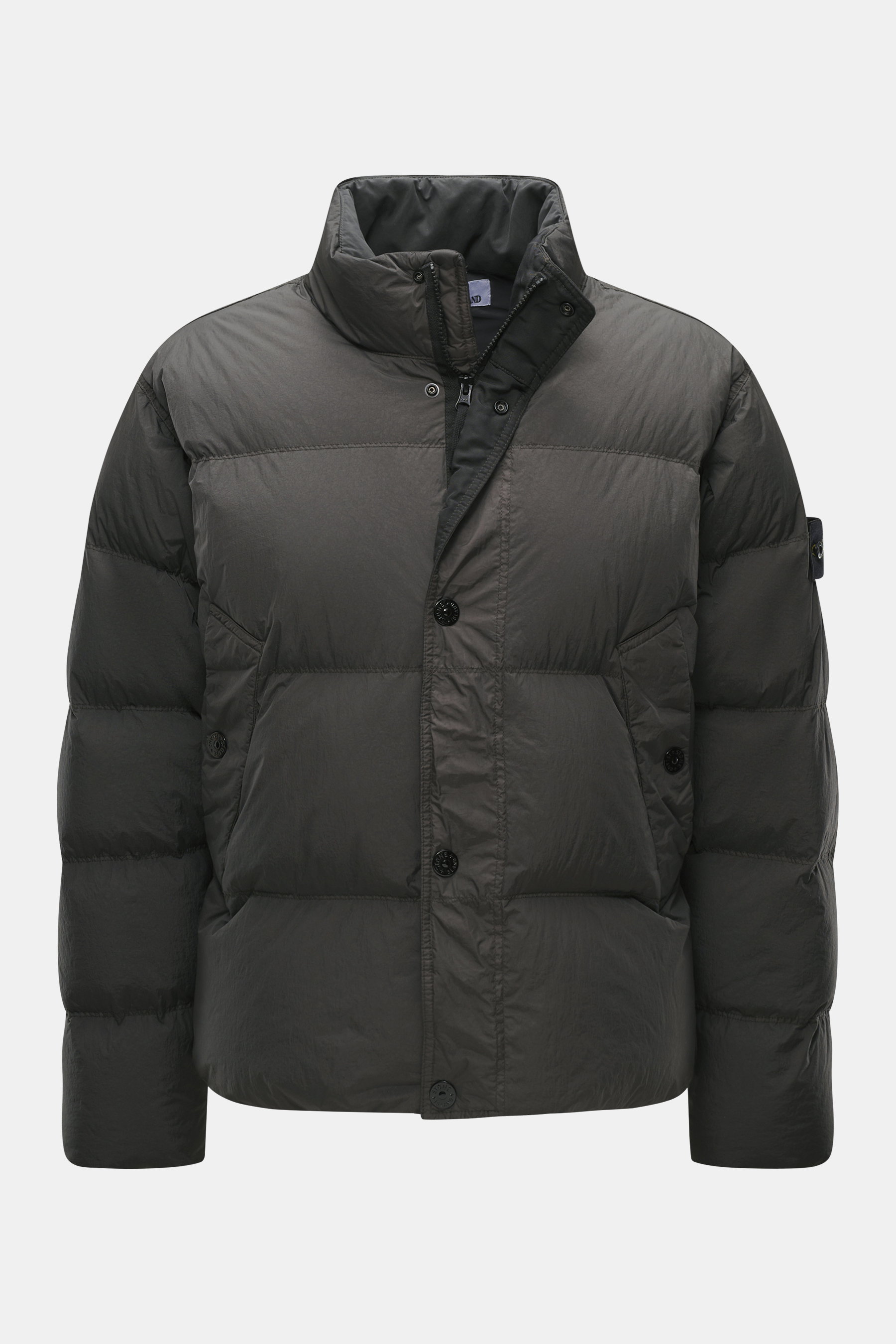 Stone Island Down jacket 'Garment Dyed Crinkle Reps NY' grey green shown from a front view, featuring lightweight, wind and water repellent microfibre with a warm down lining and signature compass badge. Innovative coated material in a garment-dyed crinkl