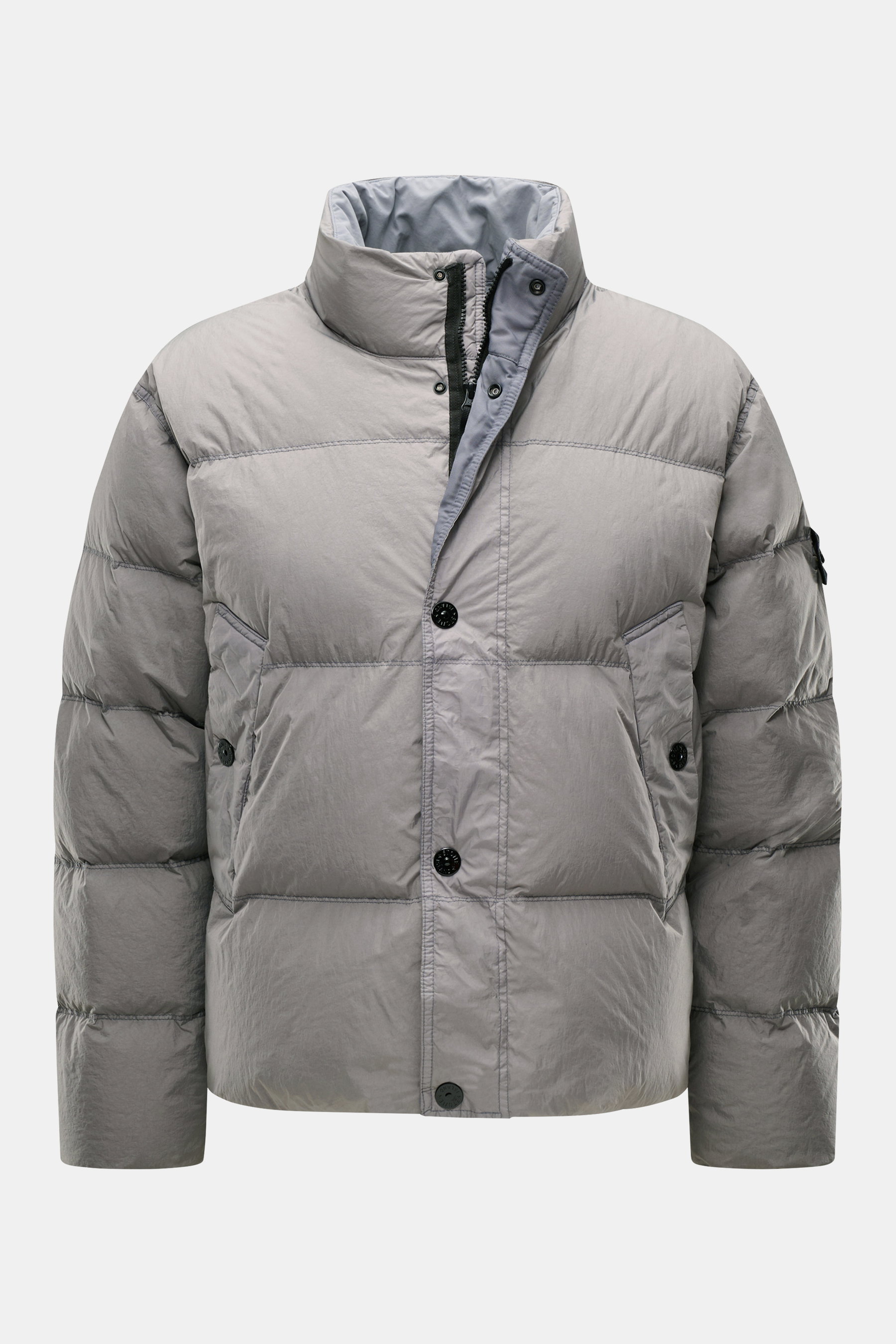 Stone Island Down jacket 'Garment Dyed Crinkle Reps NY' grey shown from the front, high collar, buttons, and slanted pockets visible; innovative coated material, garment-dyed crinkle look, lightweight, wind and water repellent, warm down lining, regular f