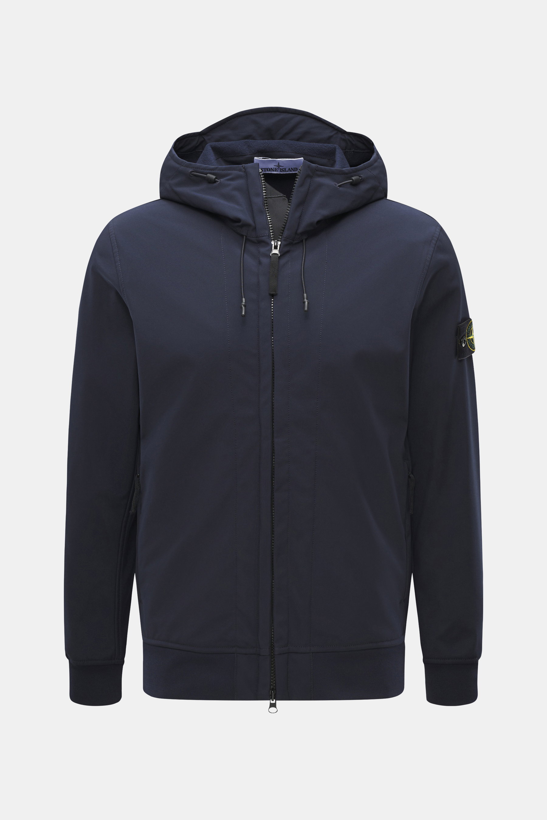 Front view of the Stone Island Softshell Blouson 'Light Soft Shell-R e.dye Technology' navy jacket with hood, zipper, and compass badge on sleeve, featuring elastic microfiber, smooth feel, wind- and water-repellent, breathable, slim fit, robust two-way z