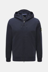 Front view of the Stone Island Softshell Blouson 'Light Soft Shell-R e.dye Technology' navy jacket with hood, zipper, and compass badge on sleeve, featuring elastic microfiber, smooth feel, wind- and water-repellent, breathable, slim fit, robust two-way z