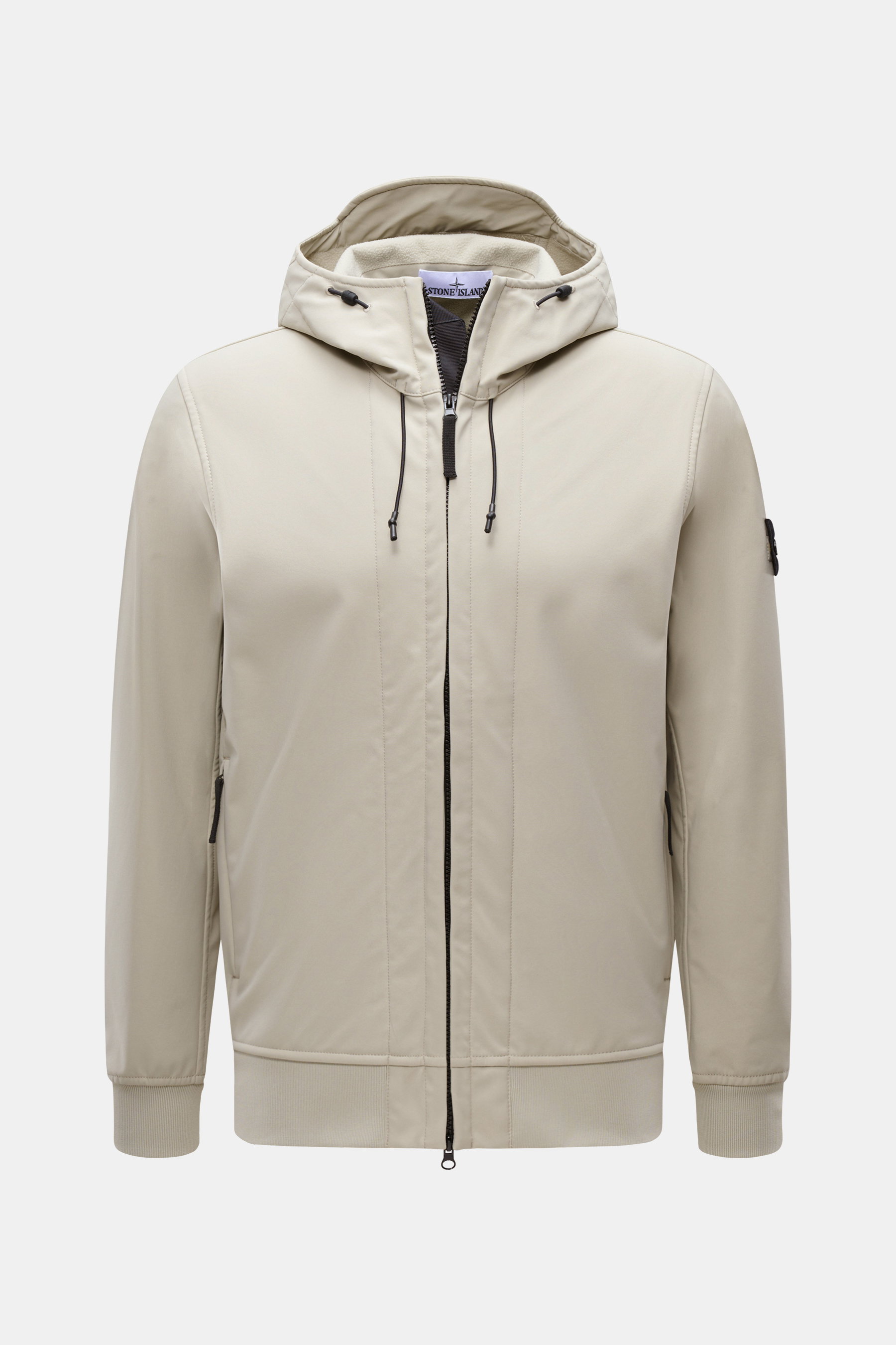 Front view of Stone Island Softshell Blouson 'Light Soft Shell-R e.dye Technology' sand jacket featuring elastic microfiber, smooth feel, wind- and water-repellent, breathable, slim fit, robust two-way zipper, high-closing stand-up collar, hood with draws
