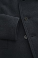 Close-up front view of Stone Island Pea Coat Navy showing wool texture, buttons, and sleeve detail, slim fit and soft touch.

Description: <p>This pea coat by STONE ISLAND features a felted surface made of fine virgin wool with a cashmere blend, making it