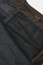 Close-up interior view of the Canada Goose Down parka 'Langford' dark brown, showing black mesh pocket and zipper. Urban style with an arctic background – the down parka 'Langford' by CANADA GOOSE impresses with its clear, functional design and protects y