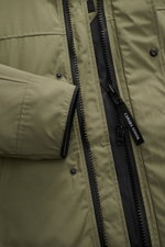 Close-up front view of Canada Goose Down parka 'Langford' grey green showing black two-way zipper, snap buttons, and smooth Arctic-Tech fabric.

Description: <p>Urban style with an arctic background – the down parka 'Langford' by CANADA GOOSE impresses wi