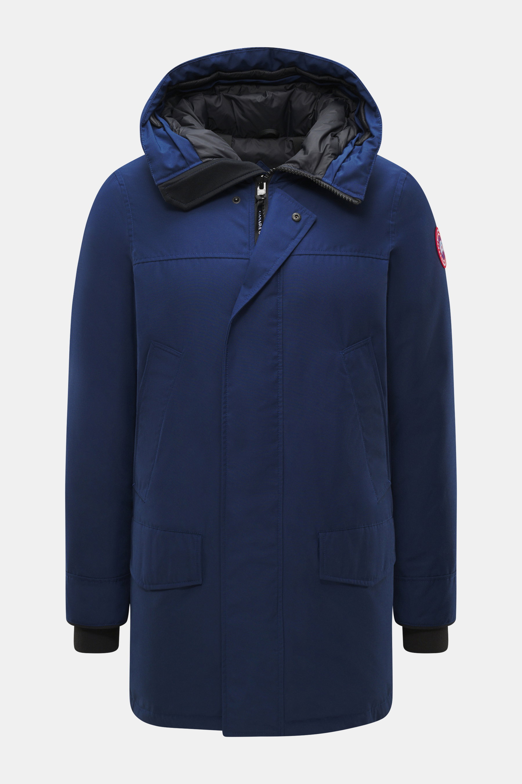 Front view of Canada Goose Down parka 'Langford' dark blue with hood, zip, flap, pockets, and logo on sleeve, urban style.

<p>Urban style with an arctic background – the down parka 'Langford' by CANADA GOOSE impresses with its clear, functional design an