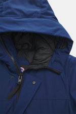 Canada Goose Down parka 'Langford' dark blue close-up from above showing hood, zipper, snap buttons, and inner lining, urban style with Arctic-Tech material. Urban style with an arctic background – the down parka 'Langford' by CANADA GOOSE impresses with 