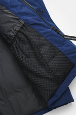 Close-up interior view from above of the Canada Goose Down parka 'Langford' dark blue, showing black mesh pocket, elastic trim, and zipper with branded pull. Urban style with an arctic background – the down parka 'Langford' by CANADA GOOSE impresses with 