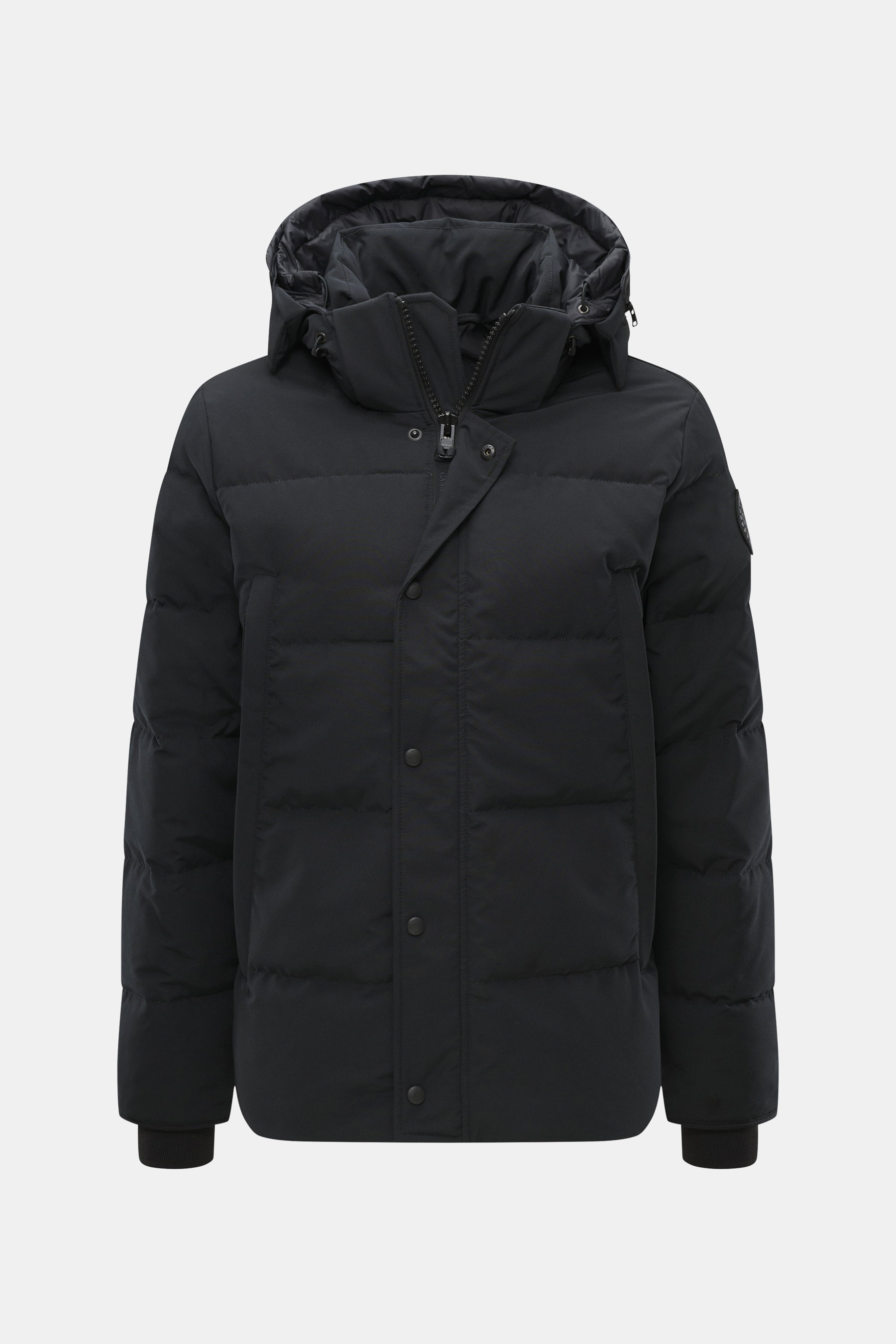 Front view of Canada Goose Down jacket 'Wyndham' black, mix of high-quality microfiber and cotton, smooth feel, warm down filling, slim fit, high-closing two-way zipper, wind flap with snap buttons, padded hood with drawstring, four welt pockets with zipp