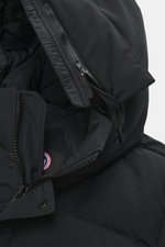 Close-up view of the hood and upper front of the Canada Goose Down jacket 'Wyndham' black, featuring a mix of high-quality microfiber and cotton, smooth feel, warm down filling, slim fit, high-closing two-way zipper, wind flap with snap buttons, padded ho