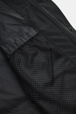Close-up interior view of the Canada Goose Down jacket 'Wyndham' black showing smooth lining fabric, mesh pocket, and high-quality microfiber and cotton.