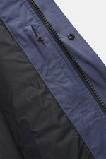 Close-up view of the Canada Goose Down jacket 'Wyndham' grey blue zipper and snap button, showing mix of high-quality microfiber and cotton, smooth feel, warm down filling, slim fit, high-closing two-way zipper, wind flap with snap buttons, padded hood wi