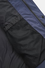 Close-up interior view of the Canada Goose Down jacket 'Wyndham' grey blue, showing smooth lining fabric, internal backpack straps, and mesh inner pocket, made from a mix of high-quality microfiber and cotton with warm down filling, slim fit, high-closing