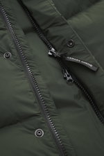 Close-up view of the Canada Goose Down jacket 'Sterling' dark green, showing high-quality microfiber fabric, smooth touch, water-repellent surface, warm down filling, oversized fit, high-closing two-way zipper with branded pull, wind flap with snap button
