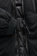 Close-up front view of the black Canada Goose Down jacket 'Lodge Hoody' showing padded hood, self-stowing lightweight down lining, two-way zip, elasticated cuffs, and quilted interior.

Description: <p>Maximum comfort in a lightweight design: Padded hood 