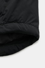 Close-up of the black fabric and stitching detail of the Canada Goose Down jacket 'Lodge Hoody' black, photographed from a top-down perspective. Maximum comfort in a lightweight design: Padded hood and lightweight down lining make the self-stowing down ja