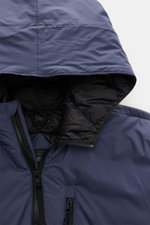 Close-up front view of the hood and upper chest of the Canada Goose Down Jacket 'Lodge Hoody' Dark Blue, featuring ripstop microfiber fabric, padded hood with drawstring, high-closing two-way zipper, and zippered chest pocket. Maximum comfort in a lightwe