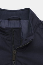 Close-up view of the collar and zipper of the Canada Goose Down jacket 'Metro' dark blue, showing ribbed wool blend collar, soft lining, and sturdy zipper. Maximum comfort in a lightweight design: The sporty 'Metro' jacket from CANADA GOOSE features warmi