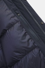 Close-up view of the Woolrich Down jacket 'Matt' navy showing the quilted lining fabric, durable two-way zipper, and inner pocket with high-quality microfiber, wind- and water-repellent, warm down filling, slim fit, wind flap with snap buttons, high-closi