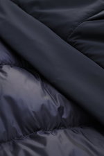 Close-up image of the Woolrich Down jacket 'Matt' navy, showing high-quality microfiber fabric, quilted lining, and slim fit from a top-down perspective. Features include wind- and water-repellent material, warm down filling, durable two-way zipper, wind 