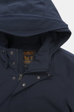 Close-up front view of Woolrich Softshell down jacket 'Barrow' dark blue, showing softshell elastic microfiber fabric, smooth feel, water-repellent, slim fit, high-closing stand-up collar, detachable hood with drawstring and visor, two-way zipper, wind fl