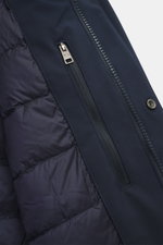 Close-up view of the inside pocket and zipper of the Woolrich Softshell down jacket 'Barrow' dark blue, made of elastic microfiber with smooth feel, water-repellent, lightweight duck down and graphene fiber filling, slim fit, two-way zipper, wind flap wit